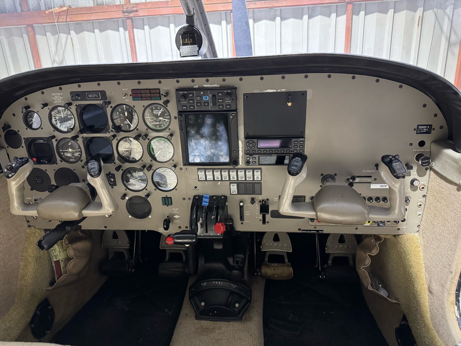 The instrument panel and center console from the left seat